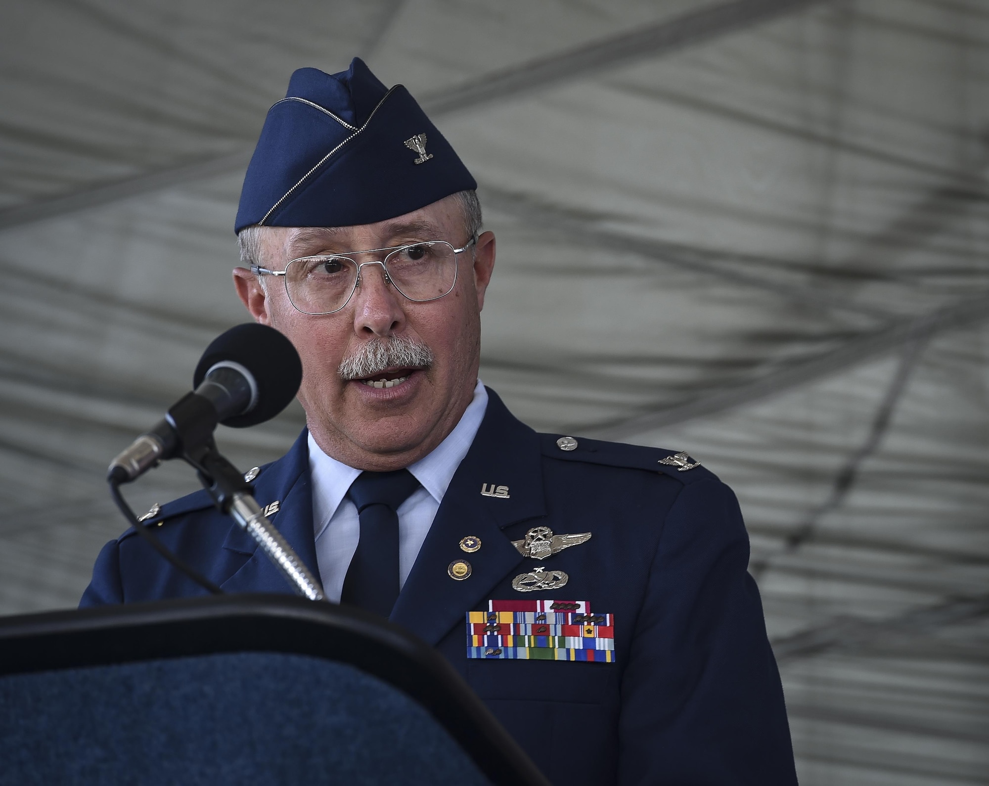 Retired Col. Mark Roland, Capt. Matthew Roland's father, speaks during Matthew's posthumous Silver Star medal presentation at Hurlburt Field, June 1, 2016.The family of Capt. Matthew D. Roland, a Special Tactics officer killed in action, was presented his posthumous Silver Star medal by Lt. Gen. Brad Heithold, commander of Air Force Special Operations Command. Matthew D. Roland gave his last full measure to protect teammates during an ambush on his convoy at an Afghan-led security checkpoint near Camp Antonik, Afghanistan, Aug. 26, 2015. The Silver Star medal is the nation's third-highest valorous combat decoration.  (U.S. Air Force photo by Senior Airman Ryan Conroy/Released)