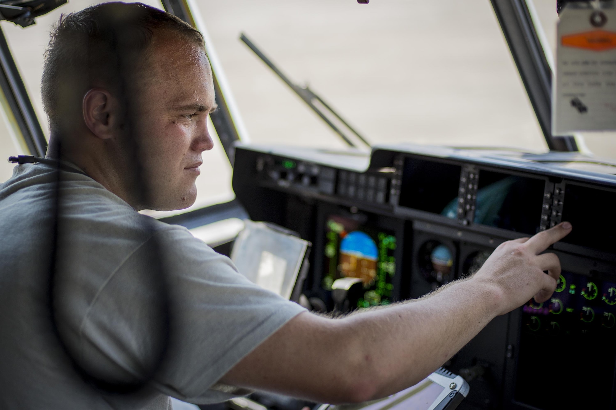 U.S. Air Force Staff Sgt. Brandon Rousseau, 23d Equipment Maintenance Squadron aerospace propulsion craftsman, tests electrical systems inside the cockpit of an HC-130J Combat King II during an isochronal inspection, May 31, 2016, at Moody Air Force Base, Ga. ISO inspections are scheduled and detailed to ensure the aircraft is in optimal condition. (U.S. Air Force photo by Airman Daniel Snider/Released)