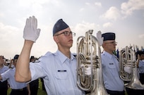 Airman 1st Class Hernando Ortega III takes his oath of enlistment during the May 27 Air Force Basic Military Training Graduation at Joint Base San Antonio-Lackland. The day is significant, as Ortega III will officially begin his Air Force career, and his father, Col. Hernando Ortega Jr. will retire after more than 30 years of service.
