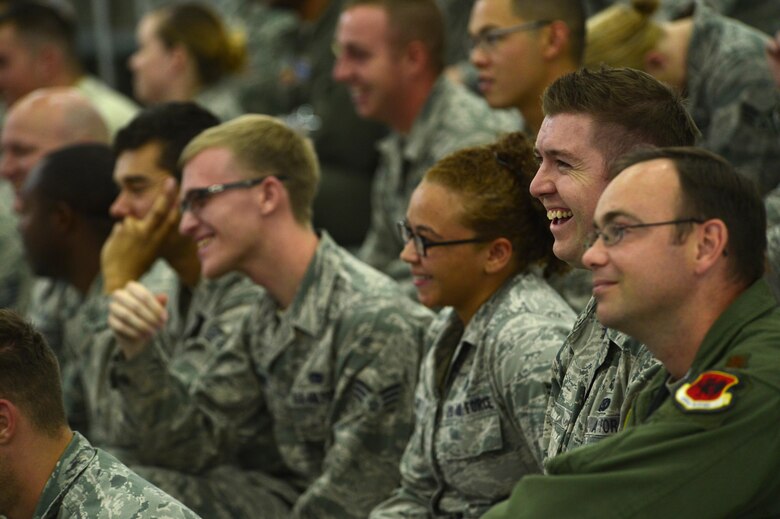 Airmen enjoy a laugh during the 432nd Operations Group 25th Anniversary May 20, 2016, at Creech Air Force Base, Nevada. The 432nd OG employs and trains more than 1100 personnel in MQ-1 Predator and MQ-9 Reaper operations. (U.S. Air Force photo by Senior Airman Christian Clausen/Released)