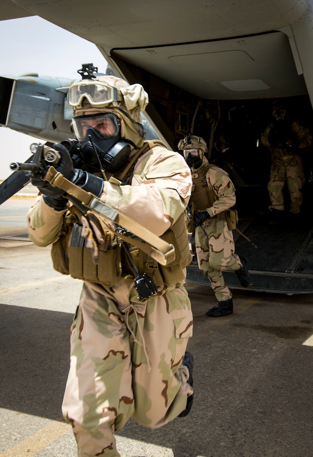 A U.S. Marine with Weapons Platoon, Fox Company, 2nd Battalion, 7th Marine Regiment, Special Purpose Marine Air-Ground Task Force-Crisis Response-Central Command 16.2, moves to a security position during Chemical, Biological, Radiological and Nuclear Defense Training at an undisclosed location in Southwest Asia, May 03, 2016. SPMAGTF-CR-CC is forward deployed in several host nations, with the ability to respond to a variety of contingencies rapidly and effectively. (U.S. Marine Corps photo by Cpl. Trever A. Statz/Released)