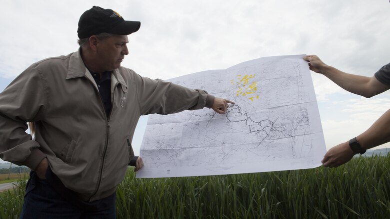 Mr. Ray Shearer, a Marine veteran and director and chairman of American Oversees Memorial Day Association, points on a map while explaining the beginning of the Battle of Belleau Wood to more than 70 Marines on a professional military education trip in the country-side of Belleau, France, May 26, 2016.  Shearer also explained the Marines who took part in the battle arrived without adequate food, water, equipment or maps of the terrain and area. 