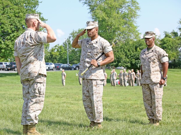 Sgt. Maj. Fletcher Pearson (center) prepares to pass the noncommissioned officer sword to Brig. Gen. Joseph Shrader (left), commander of Marine Corps Systems Command, during a Relief and Appointment ceremony June 1 aboard Marine Corps Base Quantico, Virginia. Pearson, who retired after 30 years in the Marine Corps, relinquished responsibility as the command’s senior enlisted leader to Sgt. Maj. Gary Smith (right). (U.S. Marine Corps photo by Monique Randolph)
