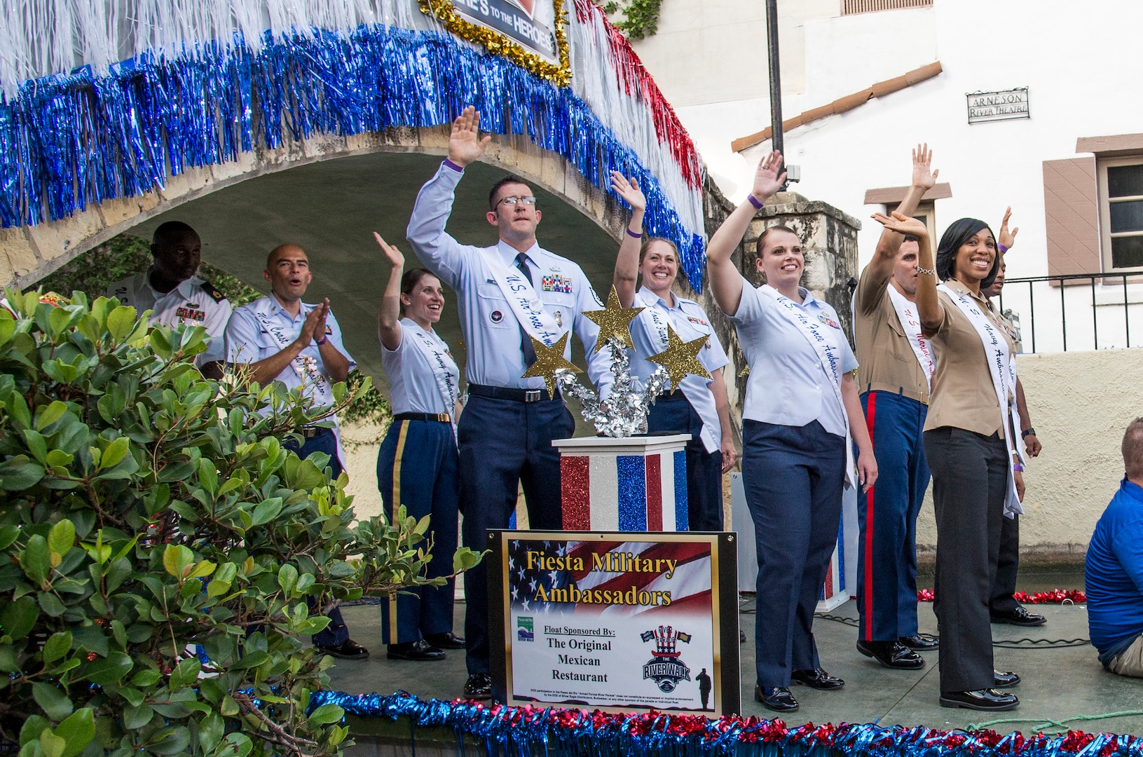 The 2016 Fiesta Ambassadors float by during the Armed Forces River Parade May 21 at the San Antonio Riverwalk. Two ambassadors from the Army, Air Force, Navy, Marines Corps and Coast Guard are selected to represent U.S. forces in San Antonio during April’s Fiesta and at other community functions throughout the year.