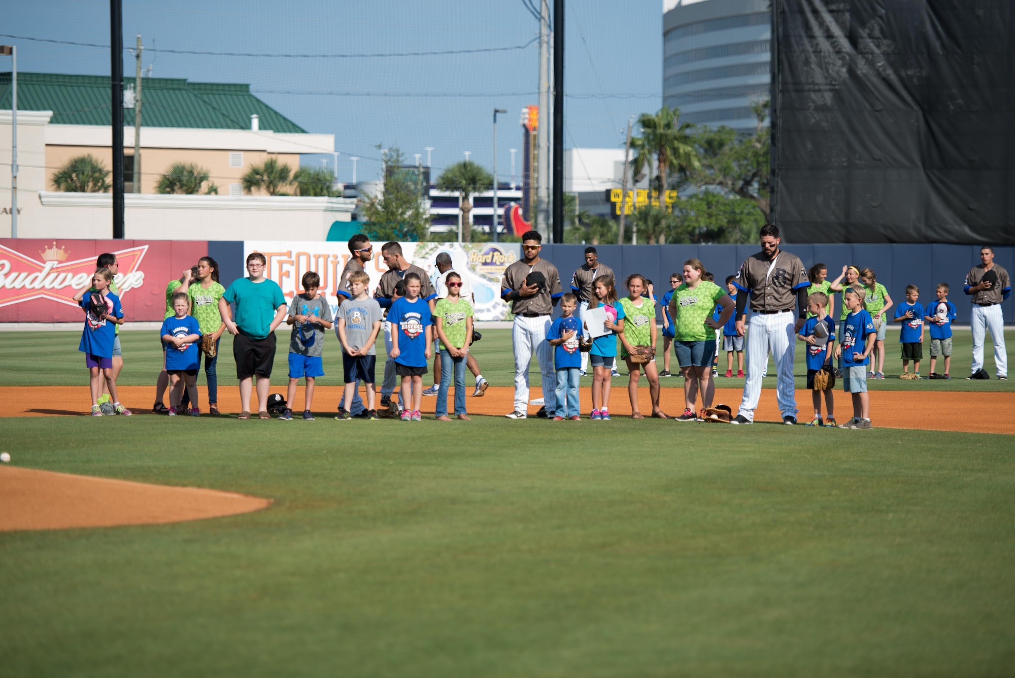 Biloxi Shuckers Minor League Baseball players line the field with Keesler children at MGM Park during the Shuckers’ Military Appreciation Game May 29, 2016, Biloxi, Miss. The children were participants at the Shuckers’ youth baseball camp held at Keesler in April. (U.S. Air Force photo by Marie Floyd)