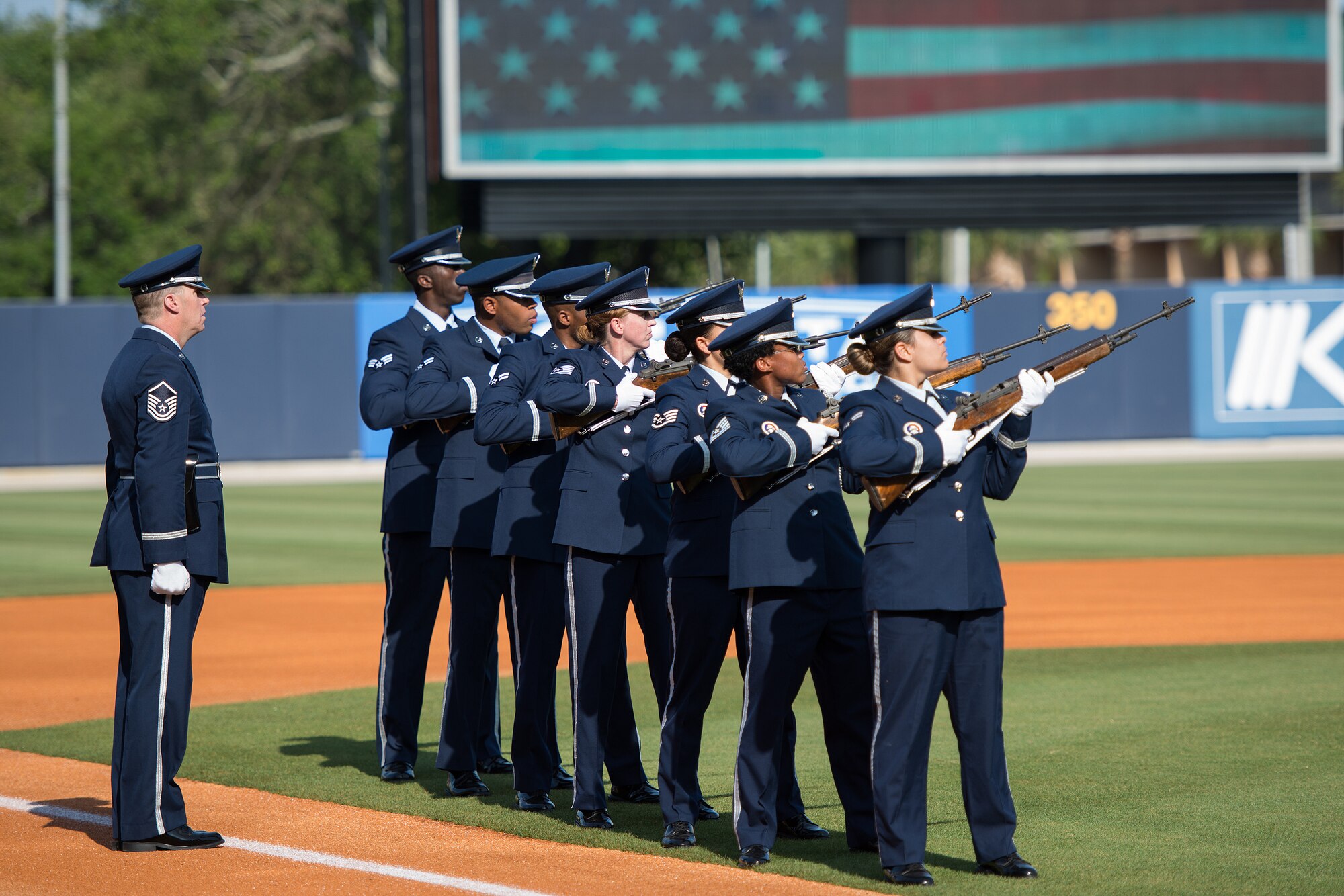 Members of the Keesler Honor Guard perform military honors at MGM Park during the Biloxi Shuckers Minor League Baseball Military Appreciation Game May 29, 2016, Biloxi, Miss. Keesler children and leadership also attended the event honoring local military members. (U.S. Air Force photo by Marie Floyd)
