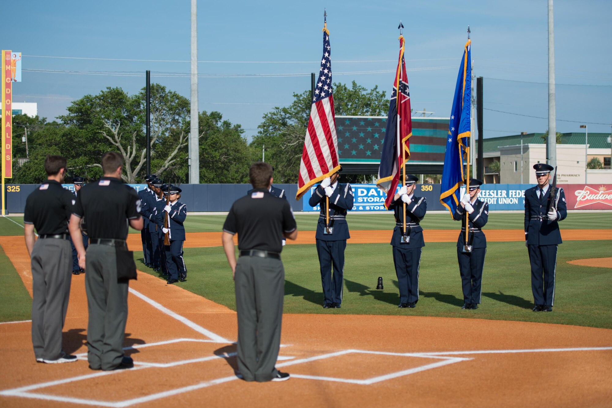 Members of the Keesler Honor Guard perform military honors at MGM Park during the Biloxi Shuckers Minor League Baseball Military Appreciation Game May 29, 2016, Biloxi, Miss. Keesler children and leadership also attended the event honoring local military members. (U.S. Air Force photo by Marie Floyd)