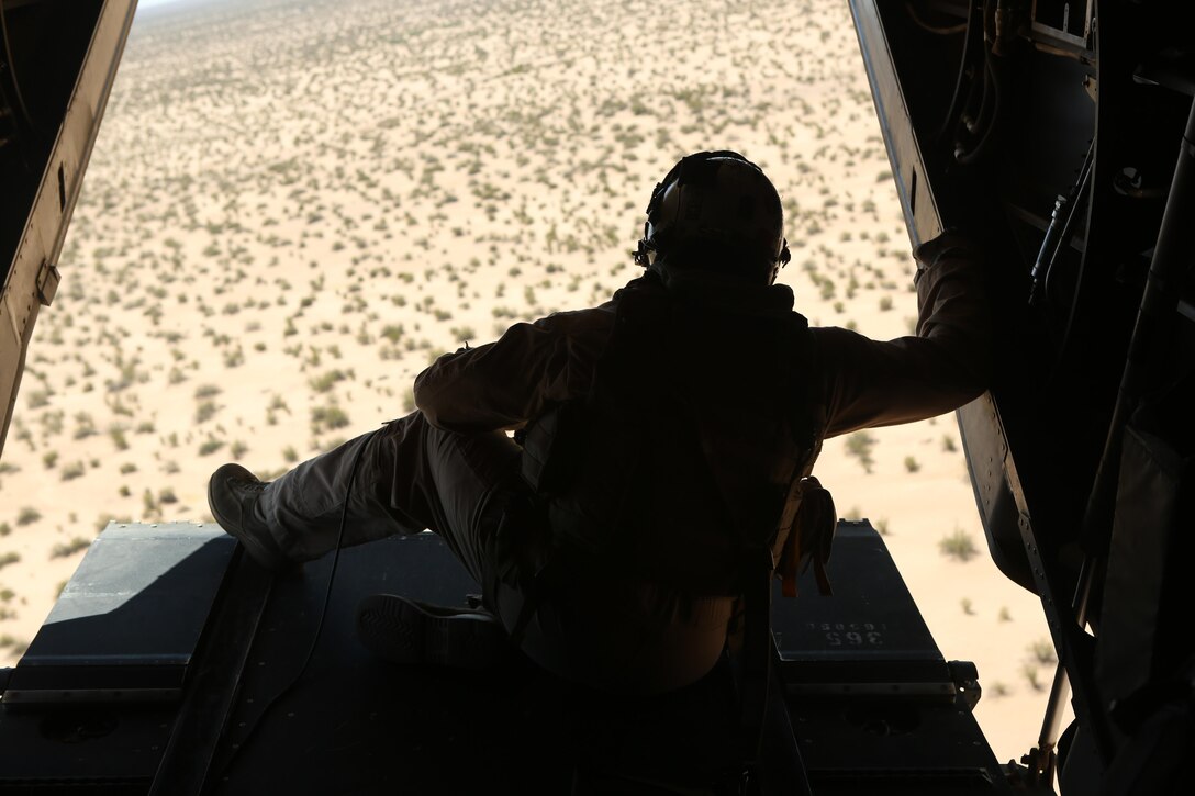 A Marine with Marine Medium Tiltrotor Squadron (VMM) 364 “Purple Foxes” checks the rear of an MV-22B Osprey during division confined area landings at Holtville Airfield, Calif., May 20. Members of the squadron conducted the training to familiarize both pilots and crew chiefs with landing in a small area near other aircraft. (U.S. Marine Corps photo by Pfc. Liah Kitchen/Released)