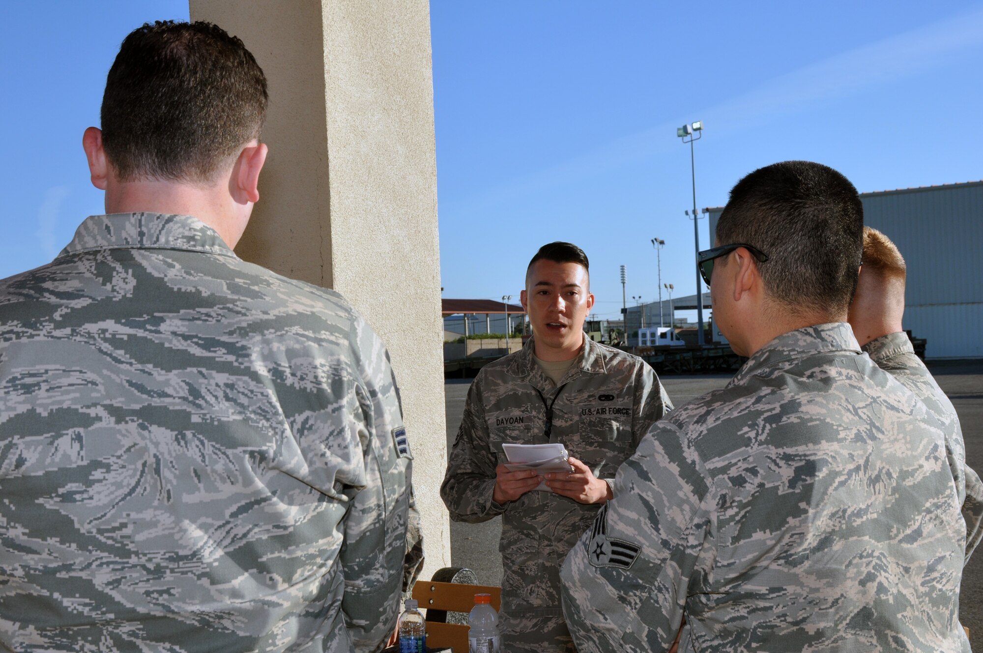 Staff Sgt. Daniel Dayoan, 55th Aerial Port Squadron ramp services, briefs the team on the upcoming KC-10 Extender cargo load training April 16, 2016 at Travis Air Force Base. (U.S. Air Force photo/Staff Sgt. Madelyn Brown)