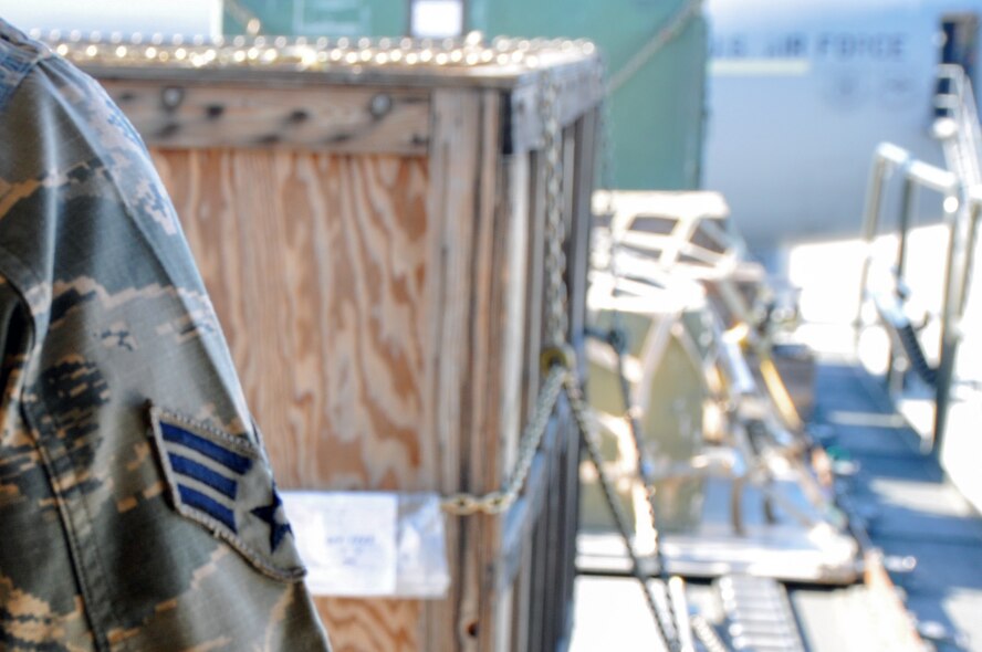 Airmen in the 55th Aerial Port Squadron complete a cargo load of a static KC-10 Extender to maintain readiness April 17, 2016 on the Travis Air Force Base flightline.  (U.S. Air Force photos/Staff Sgt. Madelyn Brown).