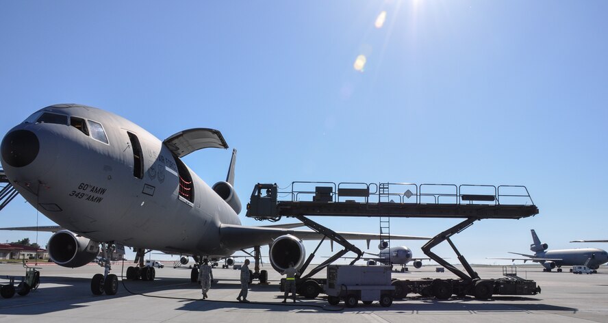 Airmen in the 55th Aerial Port Squadron complete a cargo load of a static KC-10 Extender to maintain readiness April 17, 2016 on the Travis Air Force Base flightline.  (U.S. Air Force photos/Staff Sgt. Madelyn Brown).