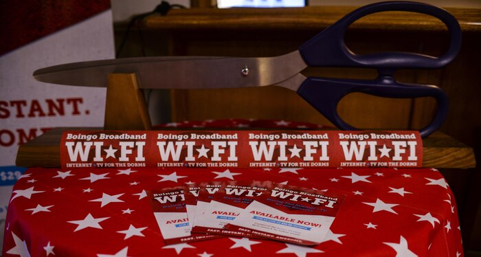 The Scissors used to cut the ceremonial ribbon sit before the Boingo “wire” cutting ceremony at Nellis
Air Force Base, Nev., May 31, 2016. Based to serve as a new option for dorm residents, Boingo wireless will go live on Nellis AFB May 26, 2016, and have multiple packages available for Airmen to choose from. (U.S. Air Force photo by Airman 1st Class Kevin Tanenbaum)
