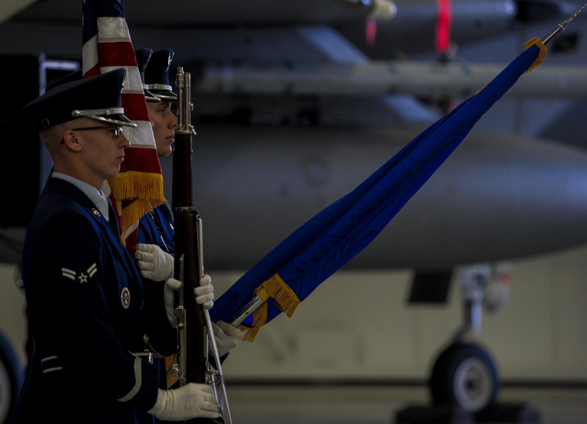 The Nellis Air Force Base honor guard presents the colors during the change of command ceremony in Lightning Aircraft Maintenance Unit hangar at Nellis Air Force Base, Nev., May 26, 2016. The 57th MXG delivers world class next generation air power in support of testing, tactics and training. (U.S. Air Force photo by Airman 1st Class Kevin Tanenbaum)