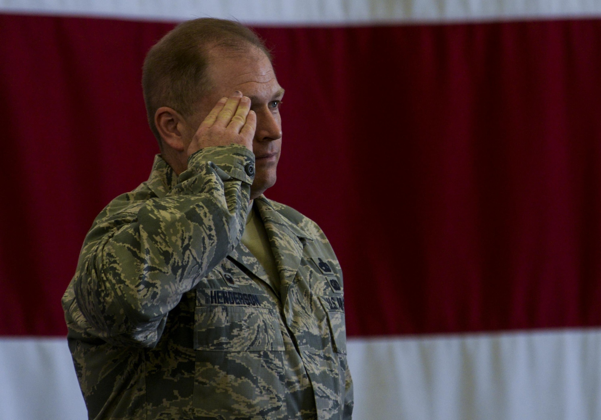 Col. Shane Henderson recieves his first salute as commander of the 57th Maintenance Group during the change of command ceremony held in Lightning Aircraft Maintenance Unit hangar at Nellis Air Force Base, Nev., May 26, 2016. Speaking to his Group for the first time, Henderson explained that while there are challenges ahead the 57th MXG will meet them head on. (U.S. Air Force photo by Airman 1st Class Kevin Tanenbaum)