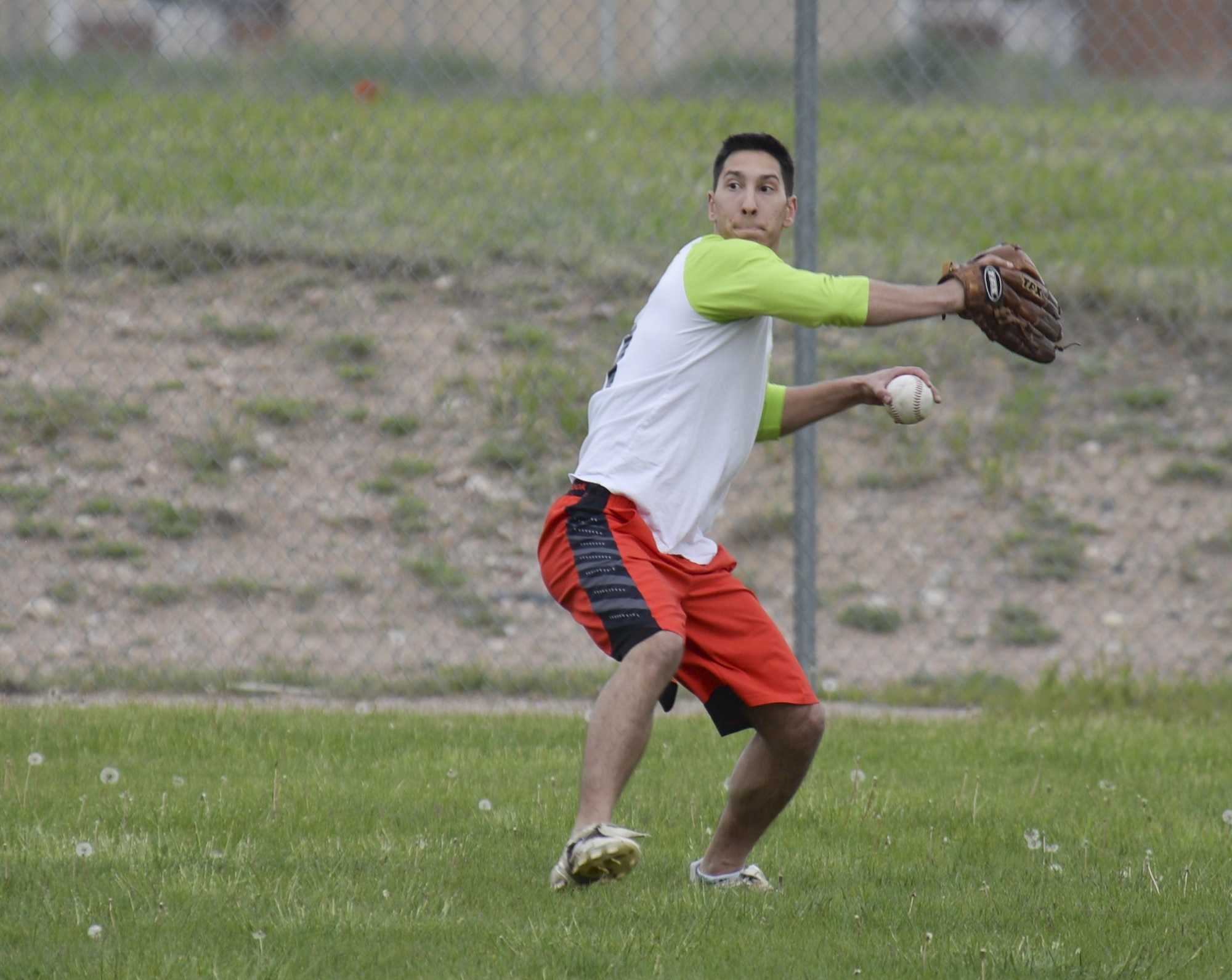 Chris Pilla, 90th Munitions Squadron intramural softball team player, throws the ball from the outfield during a play against the 790th Missile Security Forces Squadron team May 31, 2016, on one of the F.E. Warren Air Force Base, Wyo., ball fields. The MUNS team went on to win, making their record 3 and 0 for the season. (U.S. Air Force photo by Senior Airman Jason Wiese)