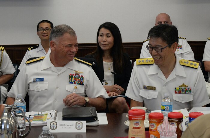 160523-N-YG103-005 SASEBO, Japan— RDML John B. Nowell, Commander, Expeditionary Strike Group SEVEN and RADM Hideki Yuasa, Commander, Mine Warfare Force have a discussion during Amphibious and Mine Warfare Staff Talks hosted by Commander, Expeditionary Strike Group SEVEN. This was the first time commander, amphibious task force and commander, landing force from both U.S. SEVENTH Fleet and Japan Self Defense Force staffs have formally joined together for staff talks. (U.S. Navy photo by Mass Communication Specialist Third Class Petty Officer Sarah Villegas/RELEASED)