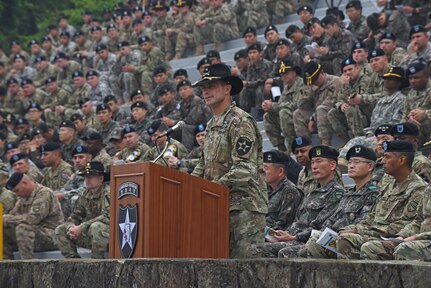 Brig. Gen. Brian Mennes, deputy commanding general for maneuver, 2nd Infantry Division, discusses the importance of the Expert Infantryman Badge and congratulates the U.S. and South Korean Soldiers that earned the badge, during a ceremony May 26 at the Schoonover Bowl, Camp Casey, South Korea. (U.S. Army photo by Staff Sgt. Keith Anderson, 1st Armored Brigade Combat Team Public Affairs, 1st Cav. Div.)