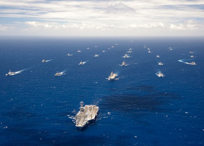 In this file photo, Ships and submarines participating in Rim of the Pacific (RIMPAC) exercise 2012 sail in formation in the waters around the Hawaiian Islands July 27, 2012. RIMPAC is a U.S. Pacific Command-hosted biennial multinational maritime exercise designed to foster and sustain international cooperation on the security on the world?s oceans. 