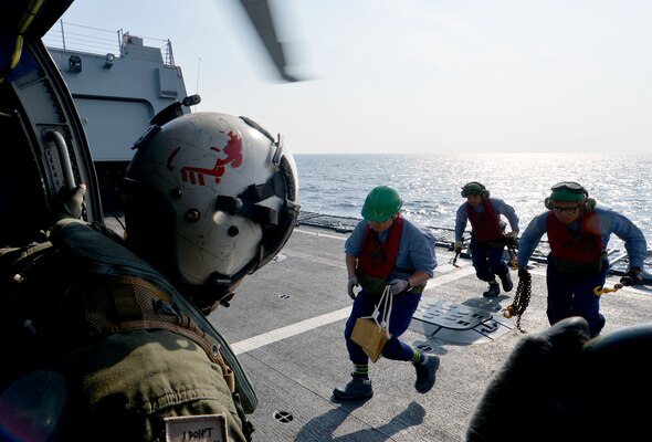 160522-N-YU572-008 WATERS SURROUNDING THE KOREAN PENINSULA (May 22, 2016) Aviation Aircrewman 2nd Class Daniel Rodriguez, assigned to the "Warbirds" of Helicopter Maritime Strike Squadron (HSM) 49, prepares to receive chocks and chains from Sailors aboard the Republic of Korea destroyer ROKS Yulgok Yi (DDG-992). The guided-missile destroyers USS Momsen (DDG 92), USS Decatur (DDG 73) and USS Spruance (DDG 111), with embarked "Devil Fish" and "Warbirds" detachments of HSM-49, are deployed as part of a U.S. 3rd Fleet Pacific Surface Action Group (PAC SAG) under Destroyer Squadron (CDS) 31. (U.S. Navy photo by Mass Communication Specialist 1st Class Jay C. Pugh/Released)