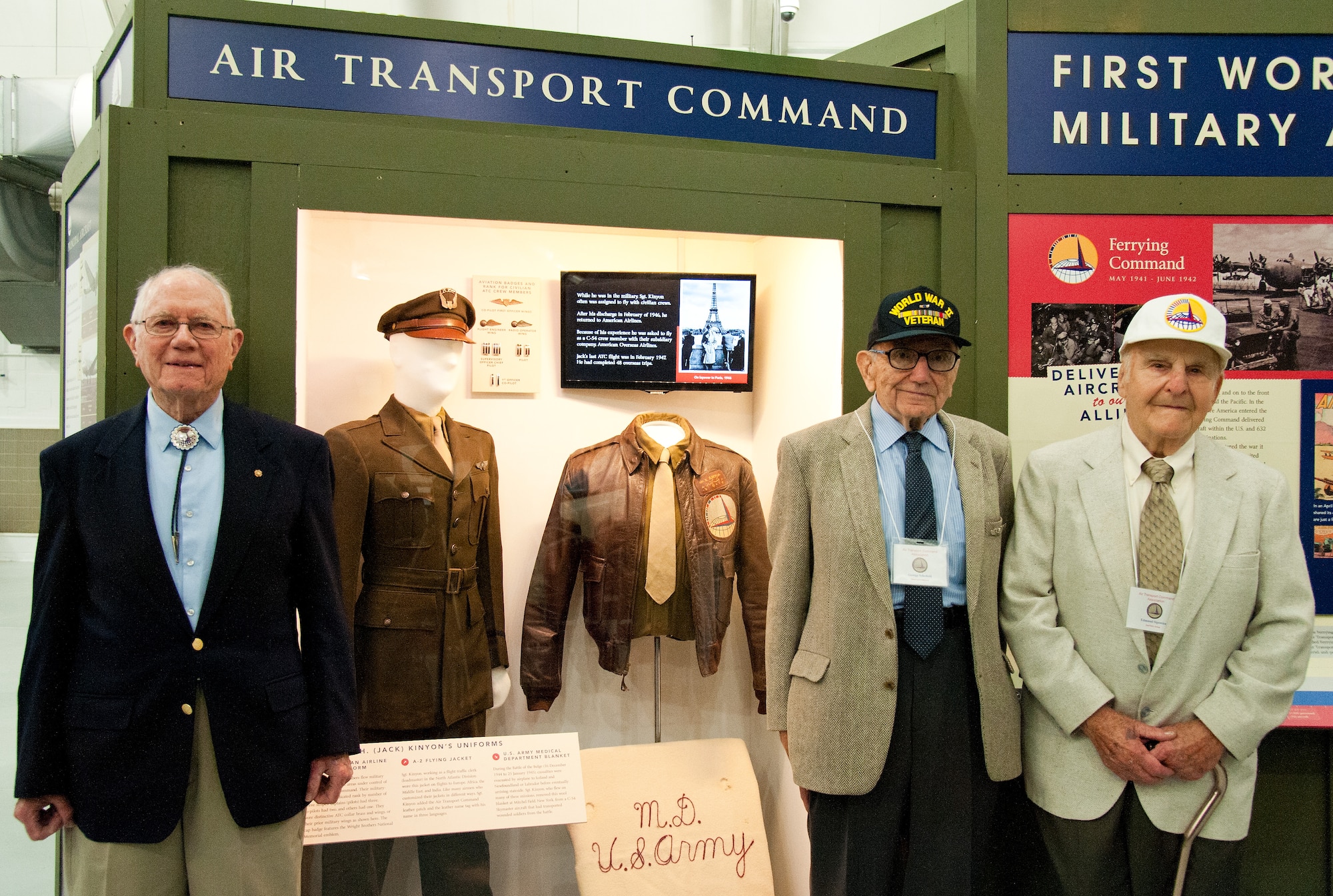 Former Air Transport Command members Jack Kinyon, flight traffic clerk; George Scholfield, navigator; and Ed Sipowicz, radio operator; left to right respectively, stand in front of the new ATC exhibit in the Air Mobility Command Museum, May 21, 2016, on Dover Air Force Base, Del. The three ATC veterans attended an exhibit unveiling ceremony that will educate visitors on the history of the ATC. (U.S. Air Force photo/Roland Balik)