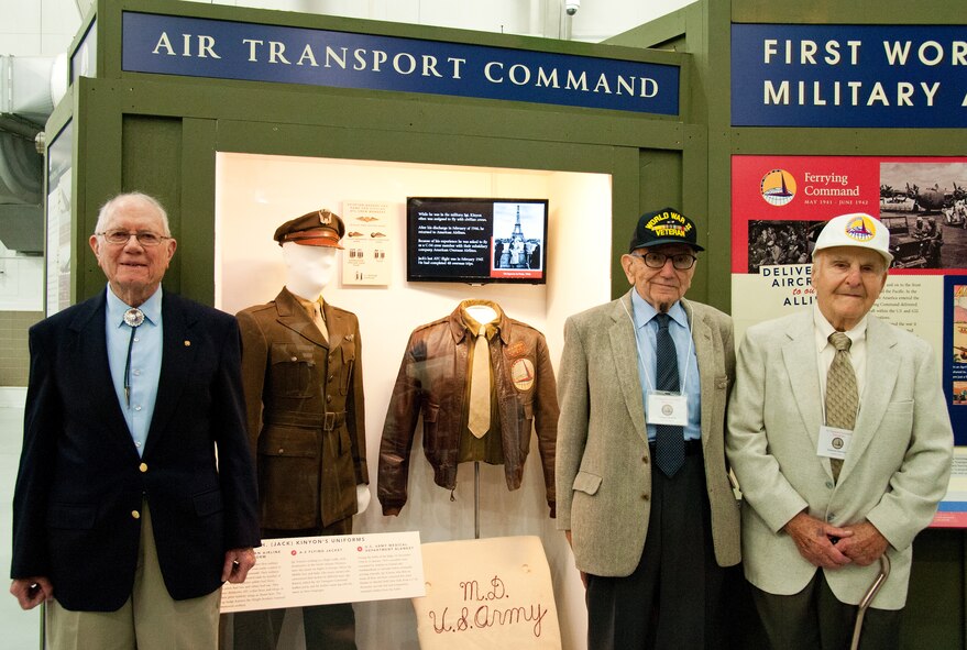 Former Air Transport Command members Jack Kinyon, flight traffic clerk; George Scholfield, navigator; and Ed Sipowicz, radio operator; left to right respectively, stand in front of the new ATC exhibit in the Air Mobility Command Museum, May 21, 2016, on Dover Air Force Base, Del. The three ATC veterans attended an exhibit unveiling ceremony that will educate visitors on the history of the ATC. (U.S. Air Force photo/Roland Balik)