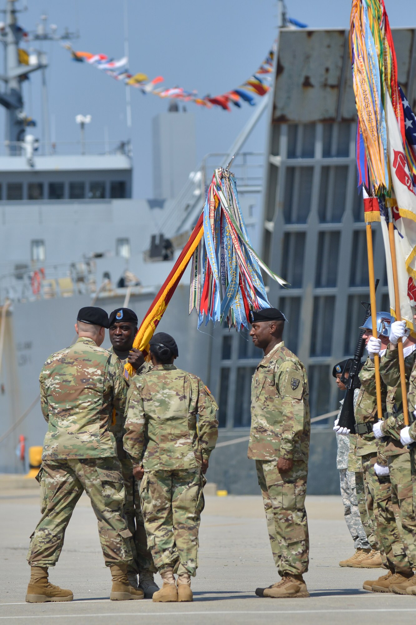 U.S. Army Command Sgt. Maj. Quillar L. Ransom Jr., command sergeant major of the 7th Transportation Brigade (Expeditionary), takes responsibility of the brigade during the passing of the colors at Fort Eustis, Va., May 26, 2016. Passing the colors symbolizes command sergeant majors passing on and accepting responsibility of the unit. (U. S. Air Force photo by Staff Sgt. Natasha Stannard)