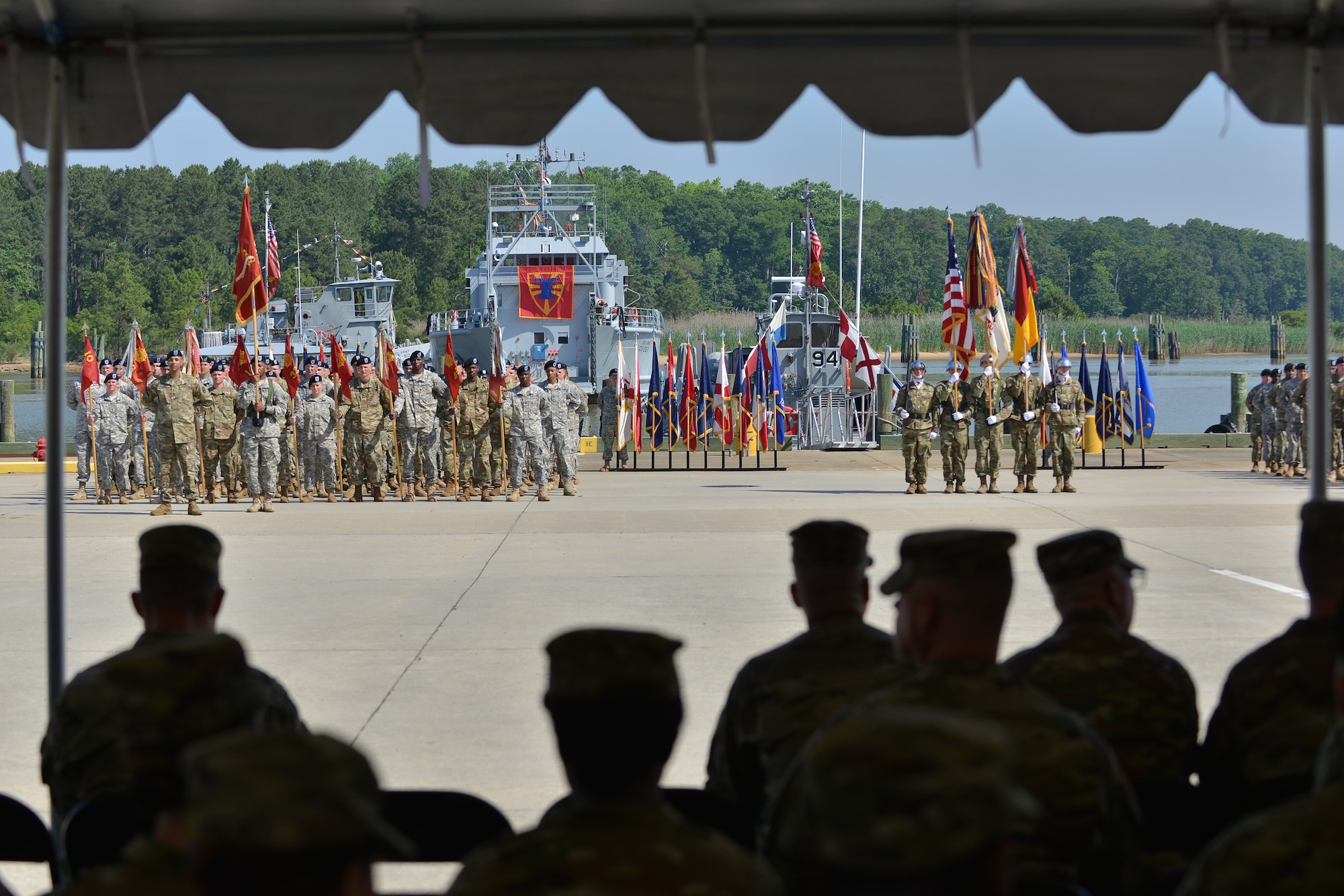Members of the 7th Transportation Brigade (Expeditionary) wait for the brigade’s change of responsibility ceremony to begin at Fort Eustis, Va., May 26, 2016. The change of responsibility involves command sergeant majors passing responsibility of command, which for this brigade involves responsibility of six battalions that deploy in support of global missions. (U. S. Air Force photo by Staff Sgt. Natasha Stannard)