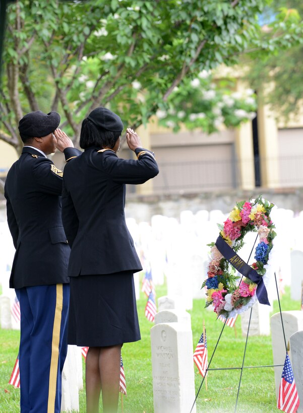 U.S. Army Soldiers salute a ceremonial wreath during a Memorial Day ceremony in Hampton, Va., May 30, 2016. Representatives from each branch of the military laid wreaths to honor members of their respective branches of service who made the ultimate sacrifice in service to the nation. (U.S. Air Force photo by Staff Sgt. Teresa J. Cleveland)