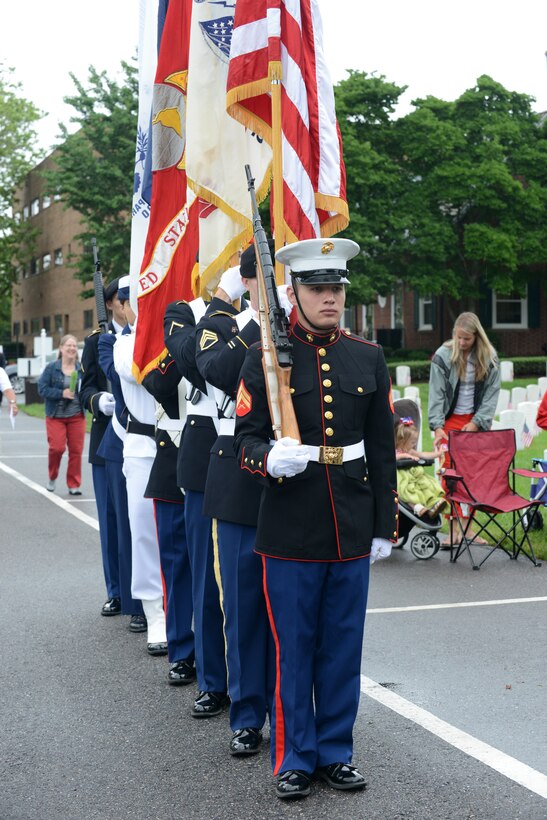 A U.S. Joint Color Guard stands by prepared to present the colors during a Memorial Day ceremony in Hampton, Va., May 30, 2016. During the ceremony, members of the U.S. Armed Forces laid wreaths on the grave sites of fallen Service members and saluted to honor their service to the nation. (U.S. Air Force photo by Staff Sgt. Teresa J. Cleveland)