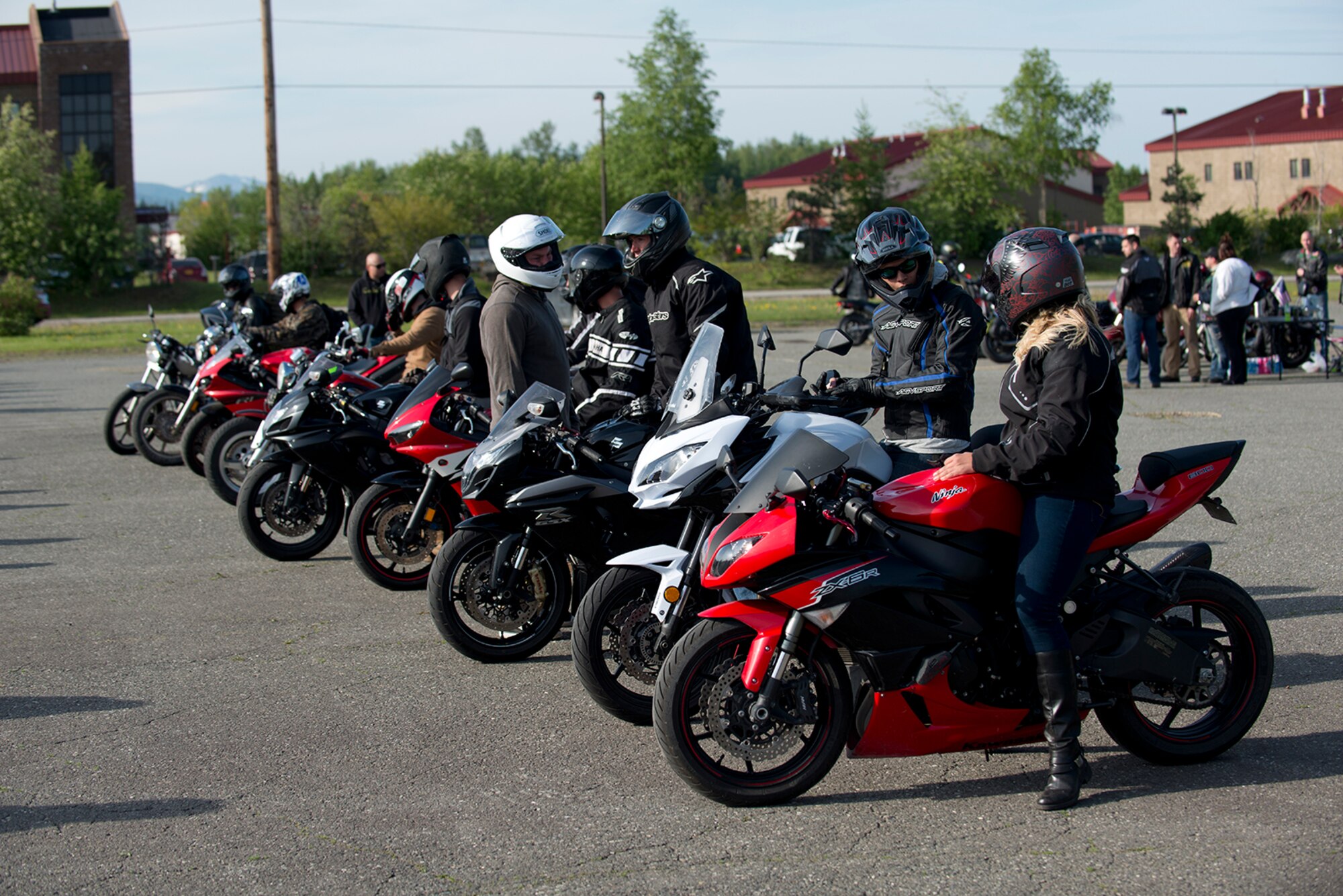 Riders wait for security forces to arrive with a police escort at the motorcycle safety pad on JBER-Richardson, May 26. The Joint Base Elmendorf-Richardson annual motorcycle safety ride is designed to connect new riders with experienced riders to foster mentor relationships and hone their skills together. (U.S. Air Force photo by Senior Airman Kyle Johnson)