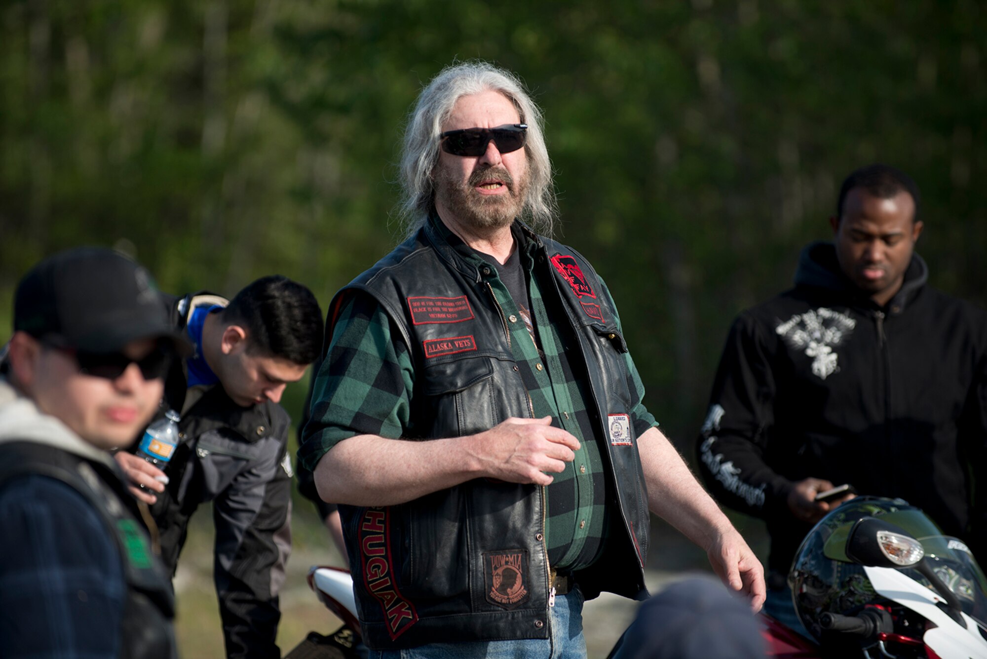 Dan “Havoc” Coffey, from the Alaska veteran's motorcycle club and motorcycle safety instructor for the event gives a safety brief to riders at the motorcycle safety pad on JBER-Richardson, May 26. The Joint Base Elmendorf-Richardson annual motorcycle safety ride is designed to connect new riders with experienced riders to foster mentor relationships and hone their skills together. (U.S. Air Force photo by Senior Airman Kyle Johnson)