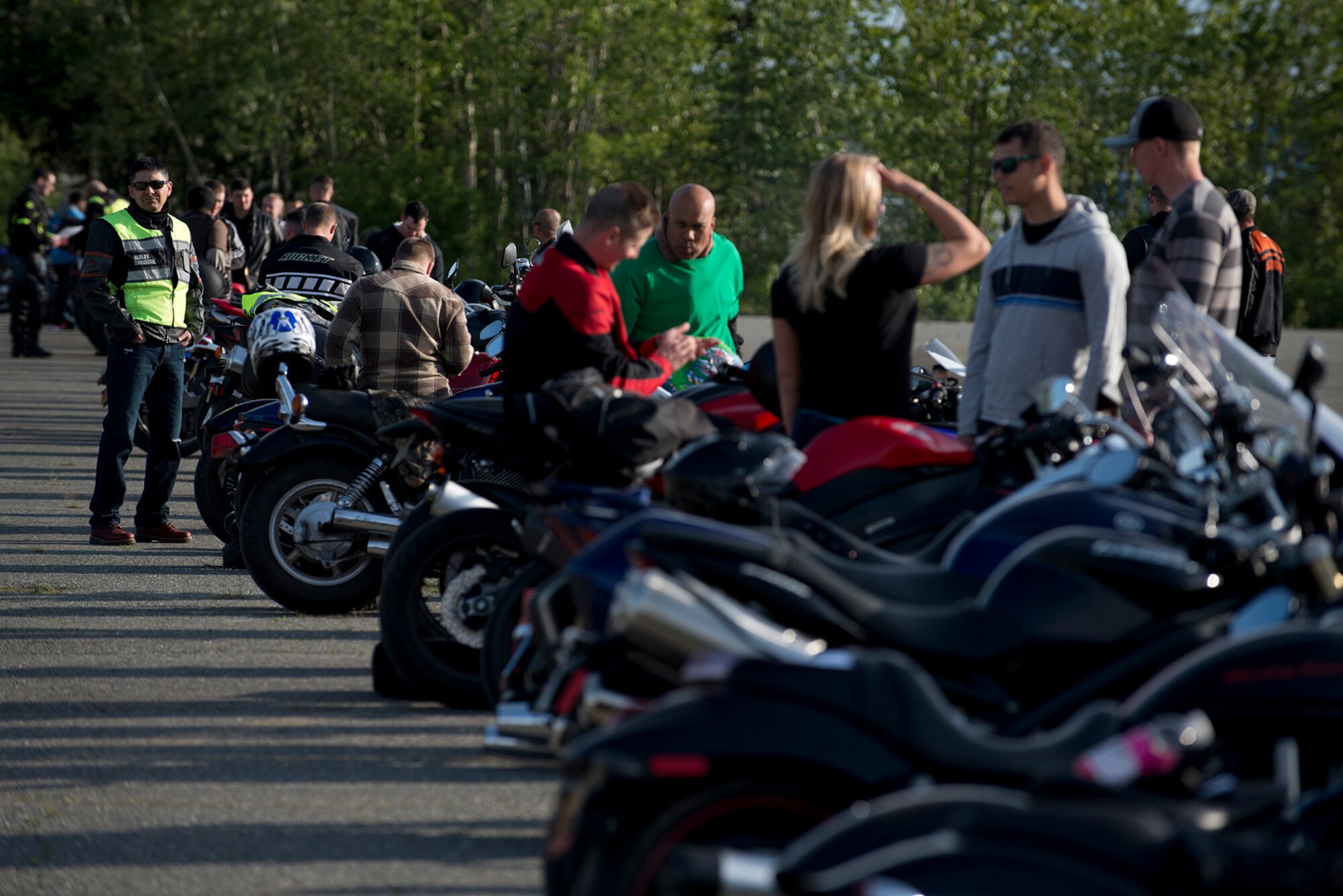Riders wait for security forces to arrive with a police escort at the motorcycle safety pad on JBER-Richardson, May 26. The Joint Base Elmendorf-Richardson annual motorcycle safety ride is designed to connect new riders with experienced riders to foster mentor relationships and hone their skills together. (U.S. Air Force photo by Senior Airman Kyle Johnson)