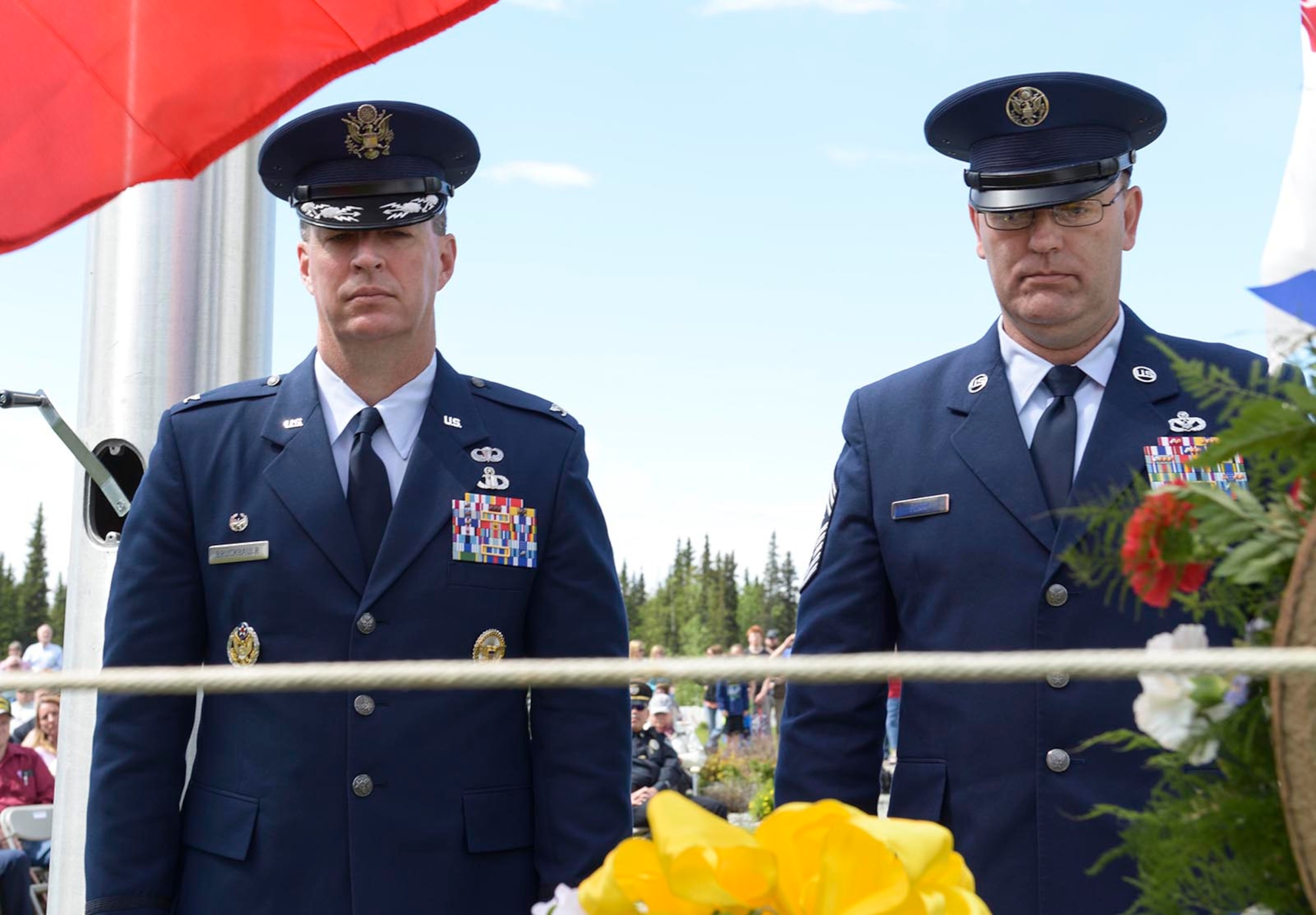 Air Force Col. Brian Bruckbauer, Joint Base Elmendorf-Richardson and 673d Air Base Wing commander, and Chief Master Sgt. Garry Berry, JBER and 673 ABW command chief, reflect after placing a wreath during the Fort Richardson National Cemetery ceremony, May 30, 2016. Memorial Day, originally known as Decoration Day, was established in 1868 by Union veterans as a time for the nation to decorate the graves of those who died during the Civil War. (U.S. Air Force Photo by Staff Sgt. William Banton)