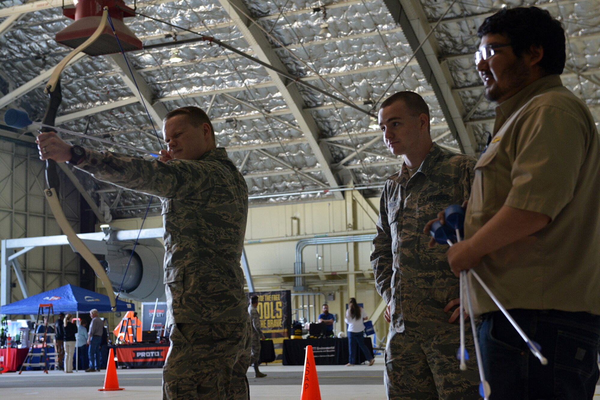 Airman 1st Class Cory Gardner, 673d Communications Squadron cyber transport systems specialist, fires a foam dart at a plastic ball at the safety fair in Hangar 1, on Joint Base Elmendorf-Richardson, Alaska, May 26, 2016.  Various vendors spanning multiple organizations provided information on how to recreate safely in Alaska. (U.S. Air Force photo by Airman 1st Class Javier Alvarez)