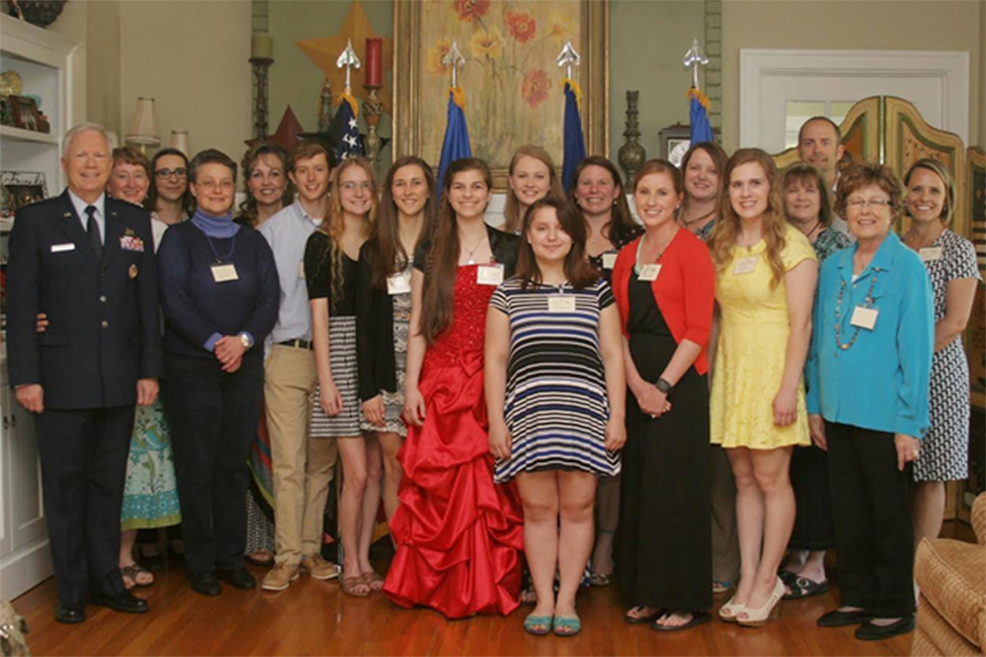 Recipients of Wright-Patterson Officers’ Spouses’ Club scholarships present at a ceremony May 22 stand with (from left) Lt. Gen. John Thompson, Air Force Life Cycle Management Center commander, and his wife and WPOSC Advisor Ruth Ann Thompson; WPOSC Welfare Treasurer Shasta Lantz; WPOSC Secretary Lori Enochian; and WPOSC President Lynne Donahue, (from the right) WPOSC Welfare Chairman Kelly Lesnick; Mah-jongg Book Sales Chairman Amy Jo Jones, WPOSC Advisor Erik Oberg, WPOSC Thrift Shop Manager Paula Cardenas; WPOSC Second Vice President Pam Woodard; and WPOSC Scholarship Chairman Stacey Imhoff. (Contributed photo)