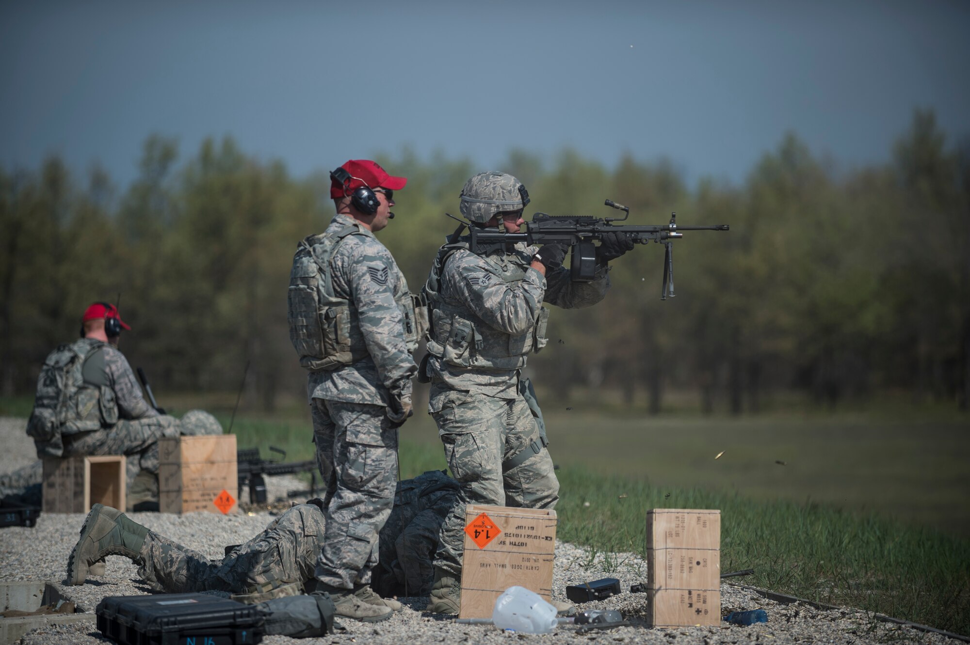 An Airman assigned to the 107th Security Forces Squadron, Niagara Falls Air Reserve Station, N.Y., engages targets with a M249 machine gun during heavy weapons training at Camp Grayling, MI., May 21, 2016. The training is part of an annual requirement for security forces in order to remain proficient and qualified on the weapon systems they are expected to carry. (U.S. Air Force photo by Staff Sgt. Ryan Campbell/released)