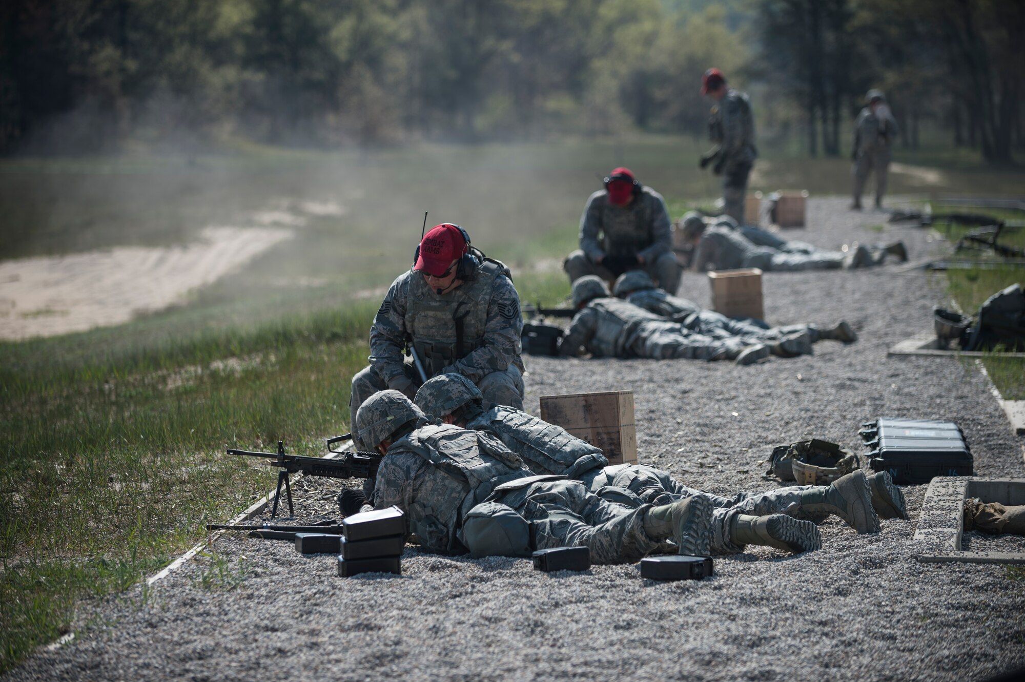 Airmen assigned to the 107th Security Forces Squadron, Niagara Falls Air Reserve Station, N.Y., engage targets with M249 machine guns during heavy weapons training at Camp Grayling, MI., May 21, 2016. The training is part of an annual requirement for security forces in order to remain proficient and qualified on the weapon systems they are expected to carry. (U.S. Air Force photo by Staff Sgt. Ryan Campbell/released)
