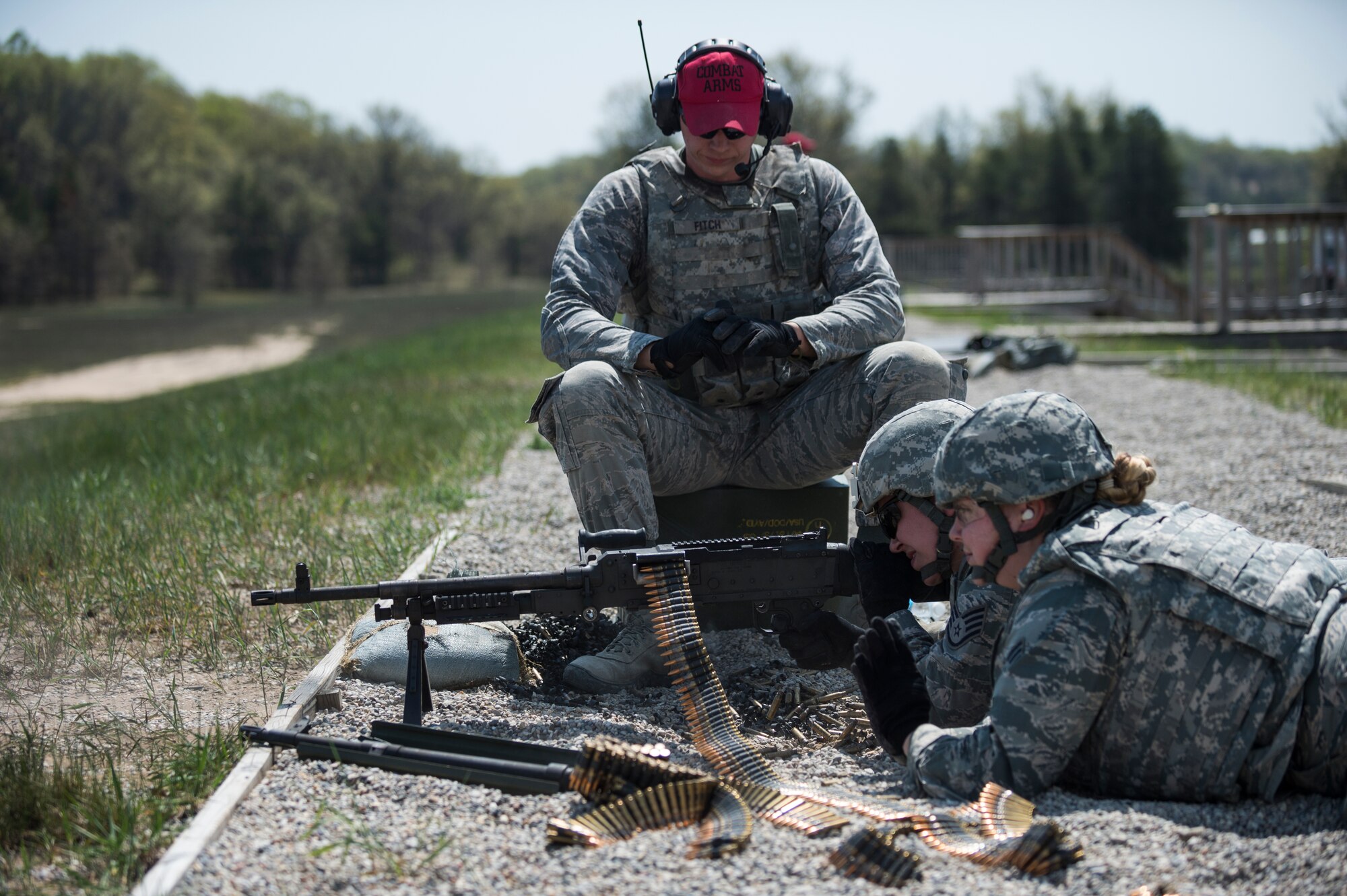 An Airman assigned to the 107th Security Forces Squadron, Niagara Falls Air Reserve Station, N.Y., engages targets with a M240B machine gun during heavy weapons training at Camp Grayling, MI., May 21, 2016. The training is part of an annual requirement for security forces in order to remain proficient and qualified on the weapon systems they are expected to carry. (U.S. Air Force photo by Staff Sgt. Ryan Campbell/released)