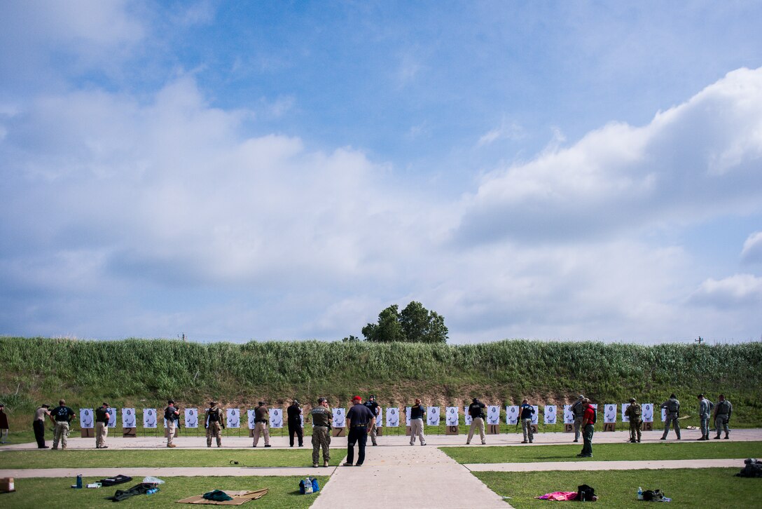 Participants of Patrol Rifle Operator School clear firearms after a weapon transition exercise at the Oklahoma County Sheriff's Office Training Center in Oklahoma City, May 26, 2016. Four Will Rogers Air National Guard Base Airmen joined local policing agencies for weapons training, May 24-26. The Oklahoma Country Sheriff's Office led the training to enhance communication and compatibility between various Oklahoma law enforcement groups. (U.S. Air National Guard photo by Senior Airman Tyler Woodward)