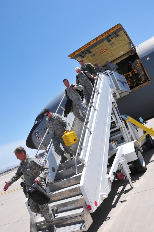 Aircrew, aircraft maintainers, and mission support experts assigned to the 161st Air Refueling Wing, Arizona Air National Guard, step off a KC-135 Stratotanker at Phoenix Sky Harbor International Airport May 31 after completing a three week deployed mission to Andersen Air Base, Guam.  (U.S. Air National Guard photo by Master Sgt. Kelly Deitloff)