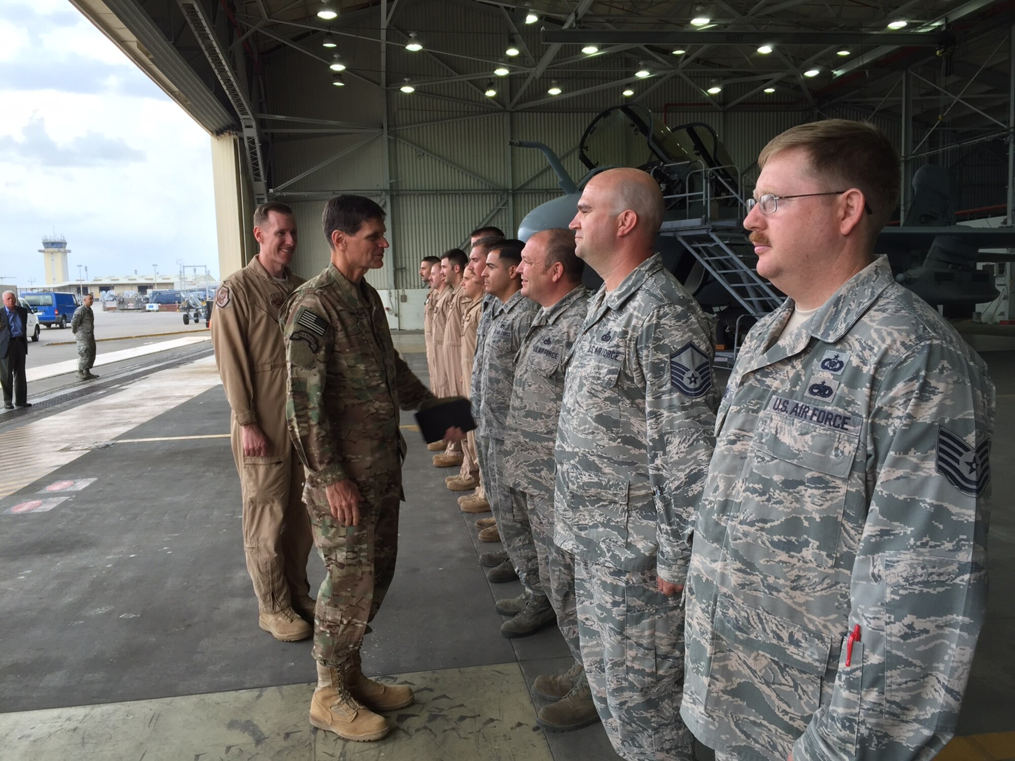 In a hangar off the flightline at Incirlik Air Base in southeastern Turkey, Army Gen. Joseph L. Votel, commander of U.S. Central Command, greets representatives from a Marine Corps EA-6 Prowler Squadron, a KC-135 tanker crew, and several aircraft maintainers, May 23, 2016. Votel was accompanied by 447th Air Expeditionary Group Commander Air Force Col. Sean McCarthy. (DoD photo by Cheryl Pellerin)