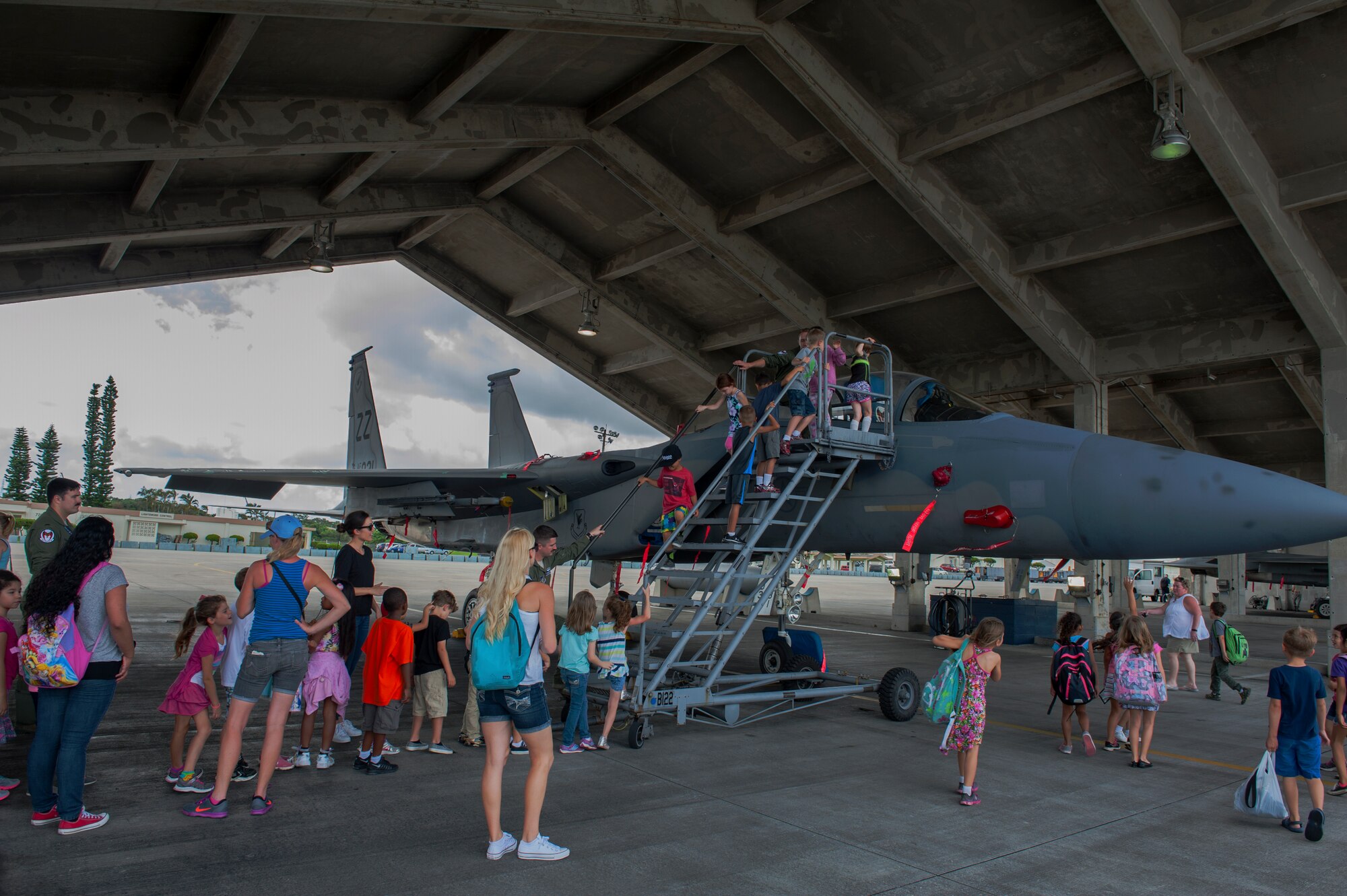 Students, parents, and staff from Bechtel Elementary School tour a 44th Fighter Squadron F-15 Eagle during a career day field trip May 16, 2016, at Kadena Air Base, Japan. The F-15 Eagle is an undefeated Mach 2 class tactical fighter that can travel at 1,875 mph.  (U.S. Air Force photo by Airman 1st Class Lynette M. Rolen)