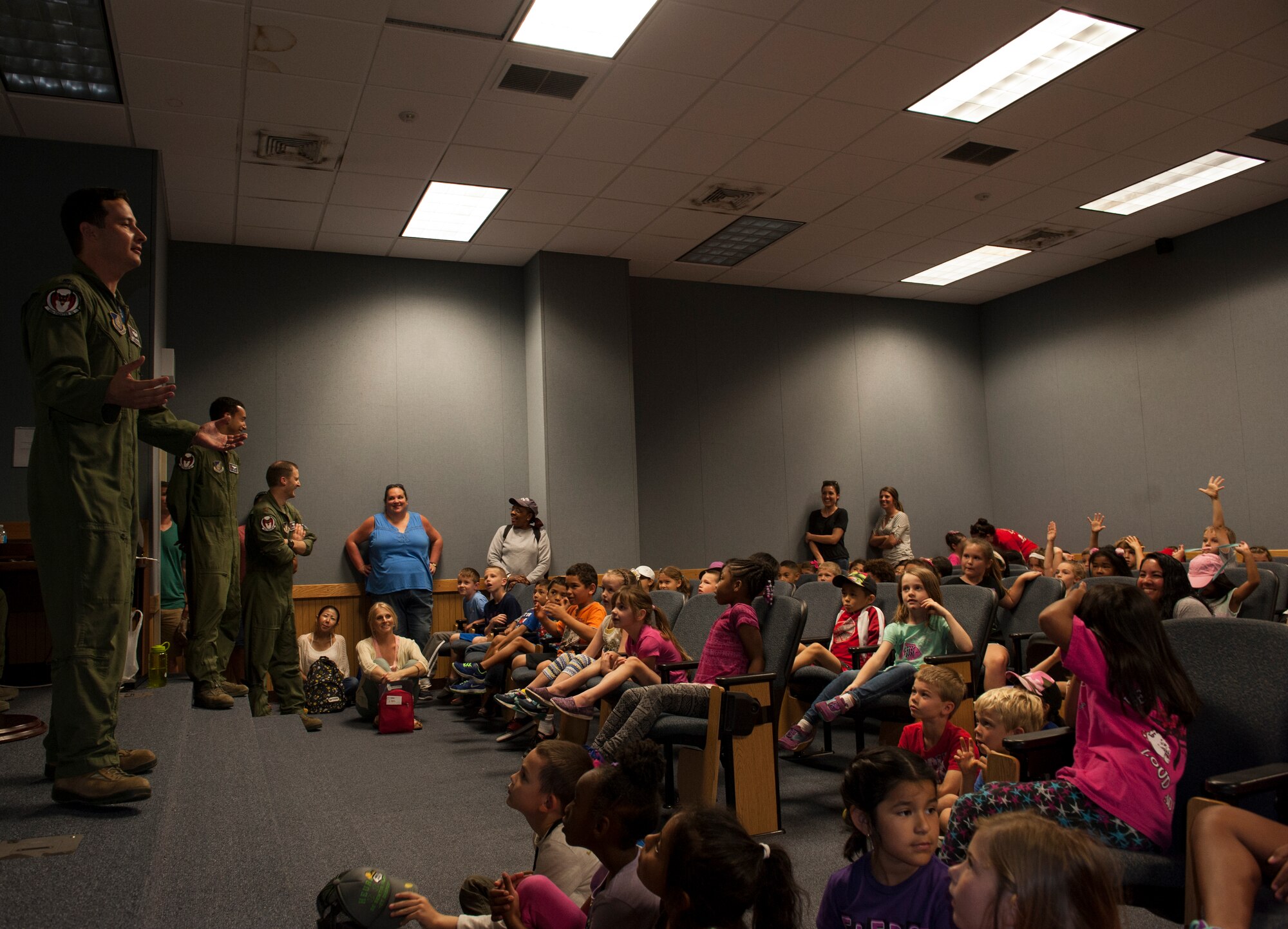 U.S. Air Force Lt. Col. Kevin Jamieson, 44th Fighter Squadron commander, welcomes first grade students from Bechtel Elementary School May 16, 2016, at Kadena Air Base, Japan. Jamieson taught the students about the 44th’s mission and about how they provide protection for people of Japan. The tour included an up-close look at the F-15 Eagle and learning about its capabilities and history. (U.S. Air Force photo by Airman 1st Class Lynette M. Rolen)