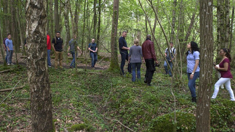 Marines walk through the woods of Belleau, France observing a trench dug by Marines during World War I, May 26, 2016. Marine Corps University sponsored the five-day, professional military educational trip for Marines from Headquarters and Service Battalion, Headquarters Marine Corps, Henderson Hall and Marine Barracks Washington, D.C. 
