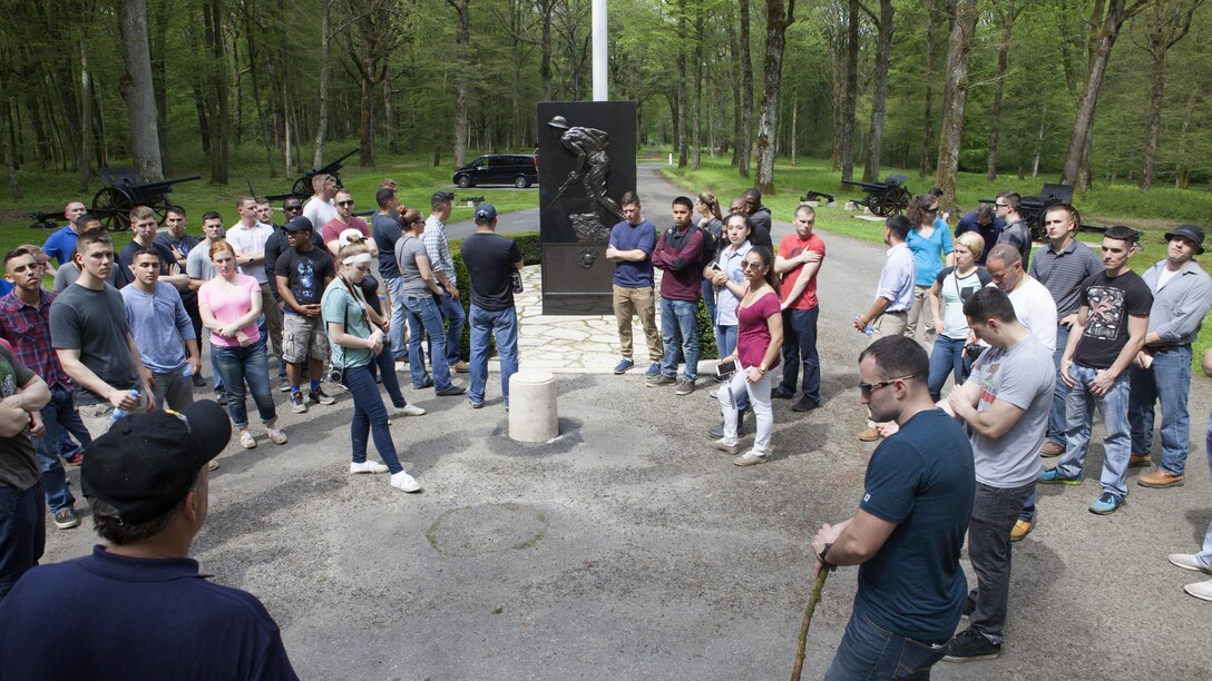 Marines from Headquarters and Service Battalion, Headquarters Marine Corps, Henderson Hall and Marine Barracks Washington, D.C., pause to reflect at the Marine Monument in the woods of Belleau, France May 26, 2016. The commanding general of the French 6th Army officially renamed Belleau Wood as “Wood of the Marine Brigade”, June 30, 1918. 