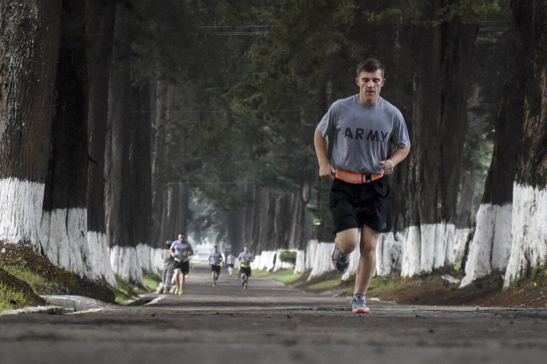 Army Spc. Edouard Sur leads in the first component of the Murph Challenge in San Marcos, Guatemala, May 30, 2016, during Beyond the Horizon 2016. The challenge, which honors Navy Lt. Michael Murphy, a Navy SEAL who died risking his life in combat, includes two 1-mile runs, 100 pullups, 200 pushups and 300 bodyweight squats. Sur is a 213th Medical Company combat medic. Air Force Tech. Sgt. Phillip Butterfield