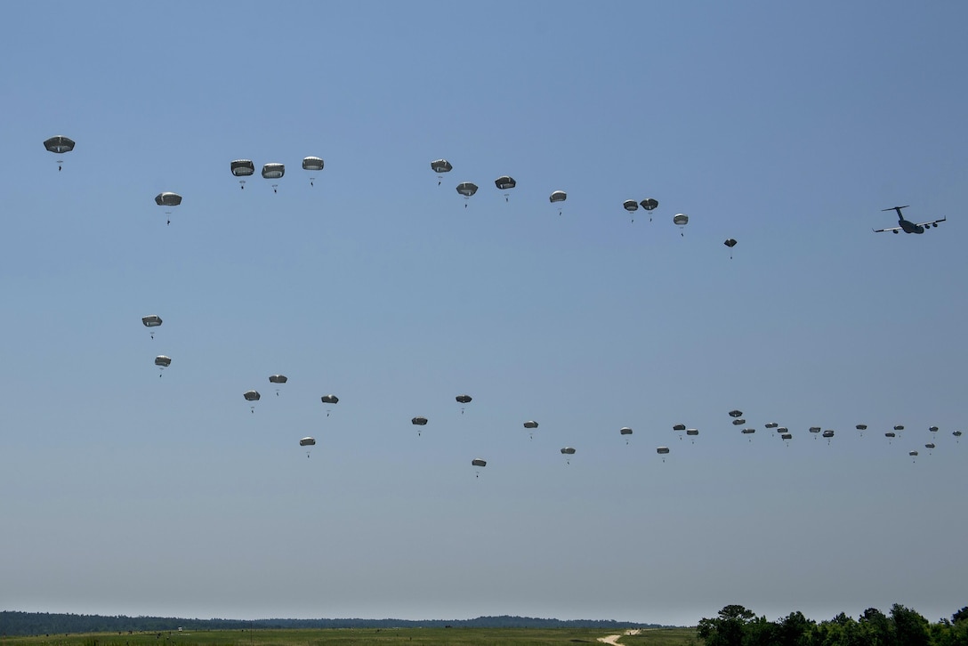 Paratroopers descend from the sky over the drop zone during exercise Crescent Reach at Fort Bragg, N.C., May 26, 2016. Air Force photo by Airman 1st Class Sean Carnes