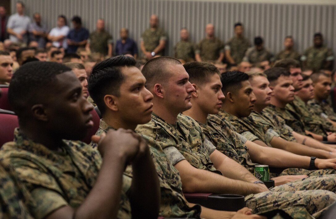 Marines gather  at Camp Foster, Okinawa, Japan, June 1, 2016,  to hear Lt. Gen. Lawrence D. Nicholson speak about the 30-day period of unity and mourning that U.S. service members on Okinawa are observing after the recent tragic loss of an Okinawan woman. Nicholson formally set aside the 30-day period for service members throughout Okinawa to reflect on the tragedy, grieve and heal with the rest of the island community.