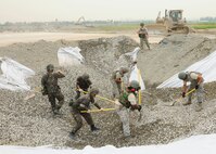 Airmen assigned to Pacific Air Forces bases excavate and refill a crater on the airfield at Gwangju Air Base during an Airfield Damage Repair bilateral training scenario on June 1, 2016. The training is part of Pacific Unity, a bilateral training exercise designed to enhance interoperability and build partnership capacity in the Indo-Asia Pacific region. (U.S. Air Force photo/Staff Sgt. Chelsea Browning)