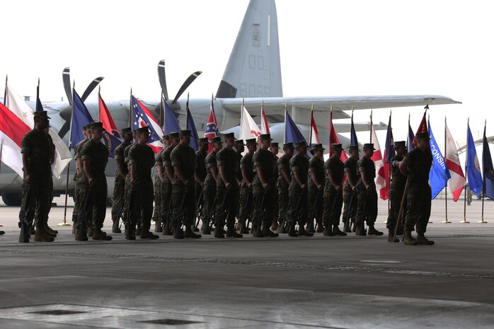 Marines with Marine Aerial Refueler Squadron (VMGR)152 stand in formation during a change of command ceremony at Marine Corps Air Station Iwakuni, Japan, May 27, 2016. Lt. Col. Matthew W. Stover, commanding officer of VMGR-152, passed his responsibillities on to Lt. Col. Andrew J. Pushart, Marine Aircraft Group (MAG) 12 special projects officer, after serving as the squadron commander for two years. (U.S. Marine Corps photo by Cpl. Nicole Zurbrugg/Released)